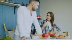 Couple arguing in a kitchen